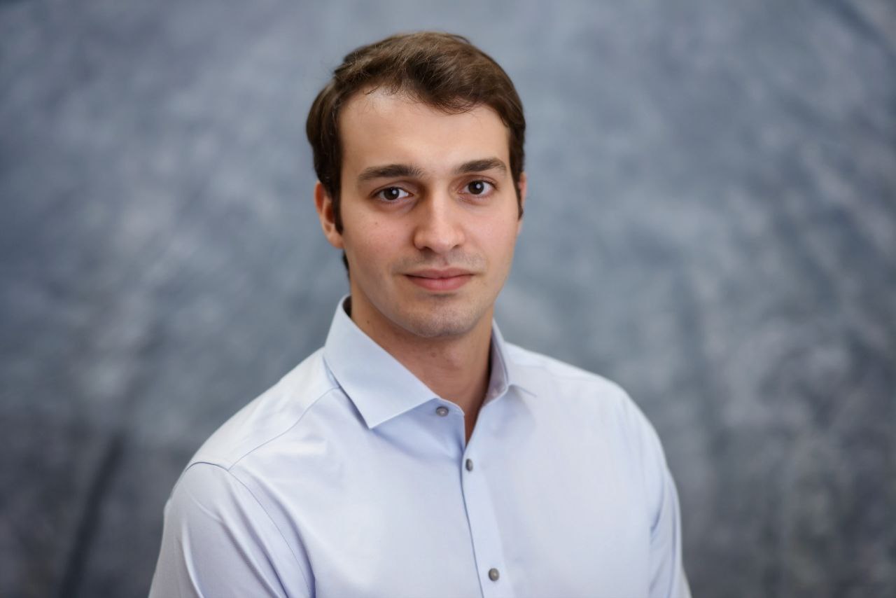 A professional headshot of Boris Benedikter